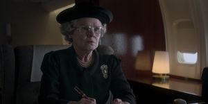the crown, actress playing the queen wears black attire and looks sad
