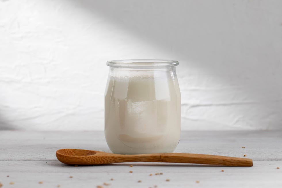 delicious kefir yogurt with wooden spoon