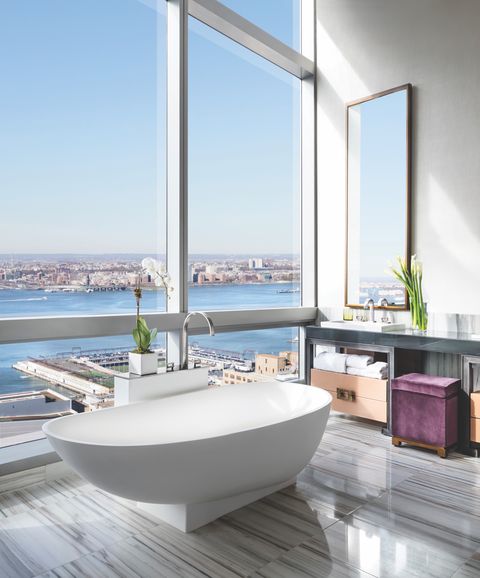tub in a new york hotel with view of hudson river