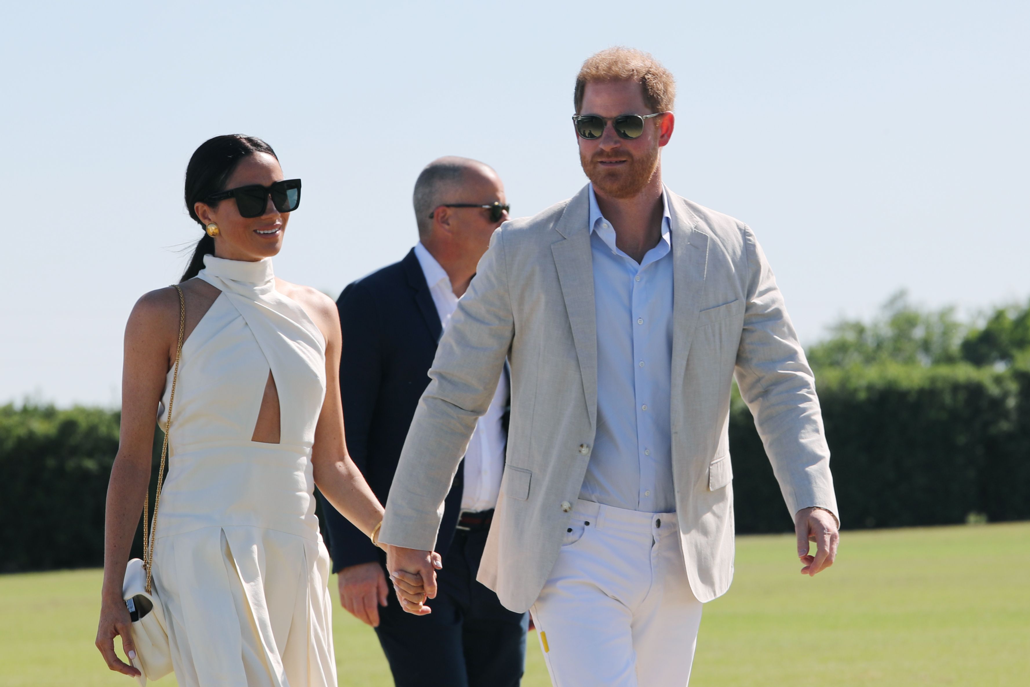 Meghan Markle Wears White Sleeveless Column Dress During Invictus Games Tour