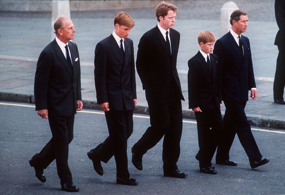 the duke of edinburgh, prince william, earl spencer, prince harry and the prince of wales follow the coffin of diana, princess of wales