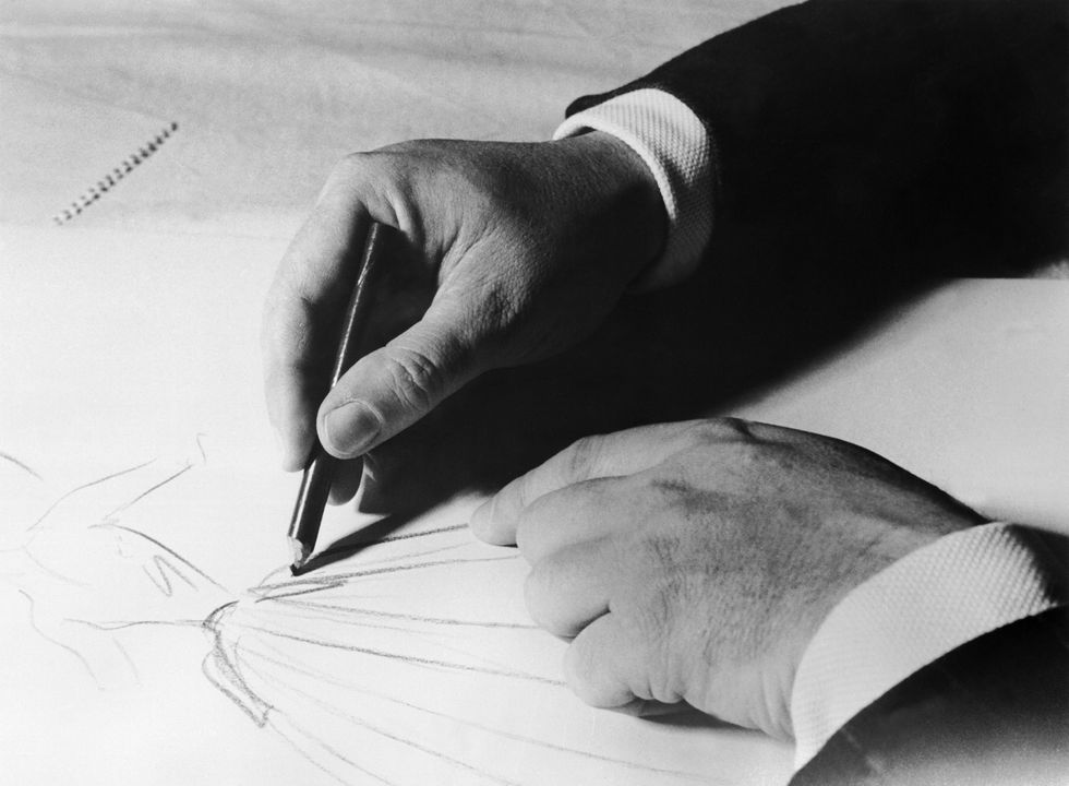 christian dior sketching a dress around 1950 1957