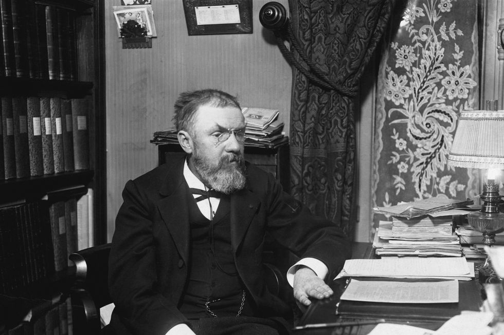 the french astronomer and mathematician henri poincare at work in his office