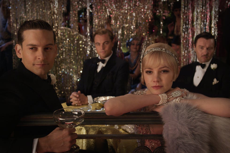 Tobey Maguire Leonardo DiCaprio and Carey Mulligan in The Great Gatsby