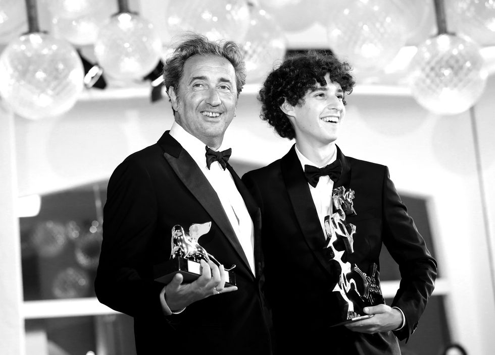 venice, italy   september 11 editors note image has been converted to black and white director paolo sorrentino poses with the silver lion grand jury prize and filippo scotti poses with the marcello mastroianni award for best new young actor for "the hand of god" at the awards winner photocall  during the 78th venice international film festival on september 11, 2021 in venice, italy photo by elisabetta a villagetty images
