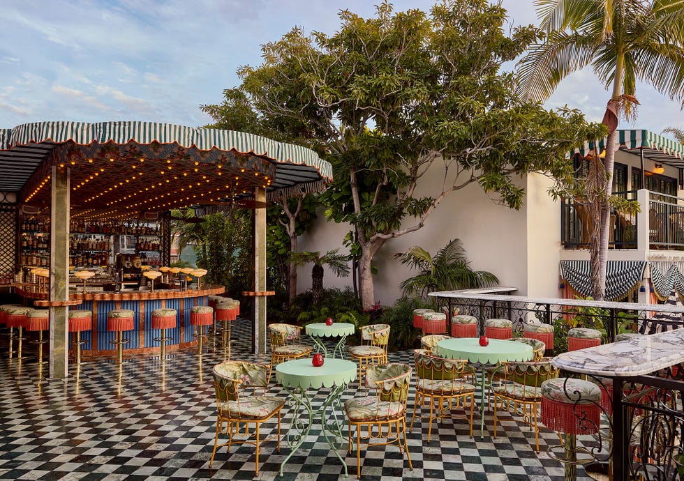 outdoor bar area with seating and a vibrant tropical atmosphere