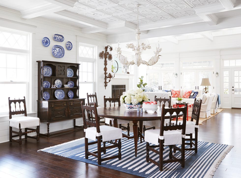 dining room with a blue and white rug and dark wood table