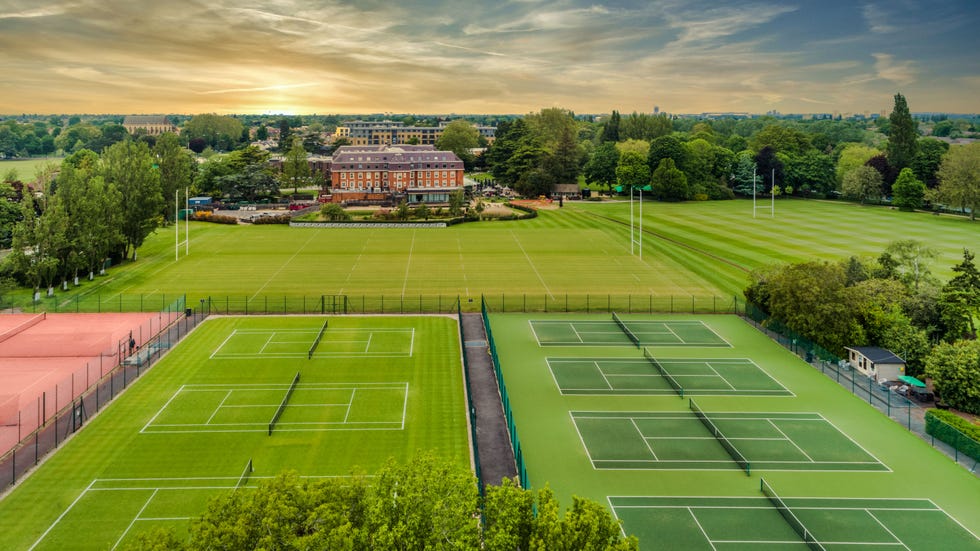 aerial shot of a hotel with its sports grounds, including tennis courts