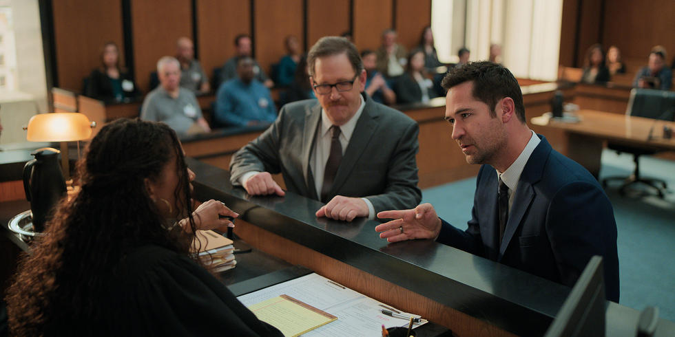 The Lincoln Lawyer from left to right Merrin Dungey as Judge Regina Turner, John Pirruccello as William Forsythe, Manuel Garcia Rulfo as Mickey Haller in Episode 308 of The Lincoln Lawyer Courtesy of Netflix © 2024