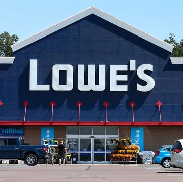 the lowe's logo is displayed on the front of the store near