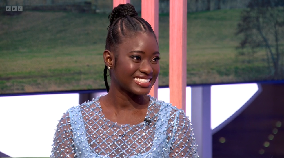 death in paradise actor shantol jackson smiling and sitting on the one show sofa