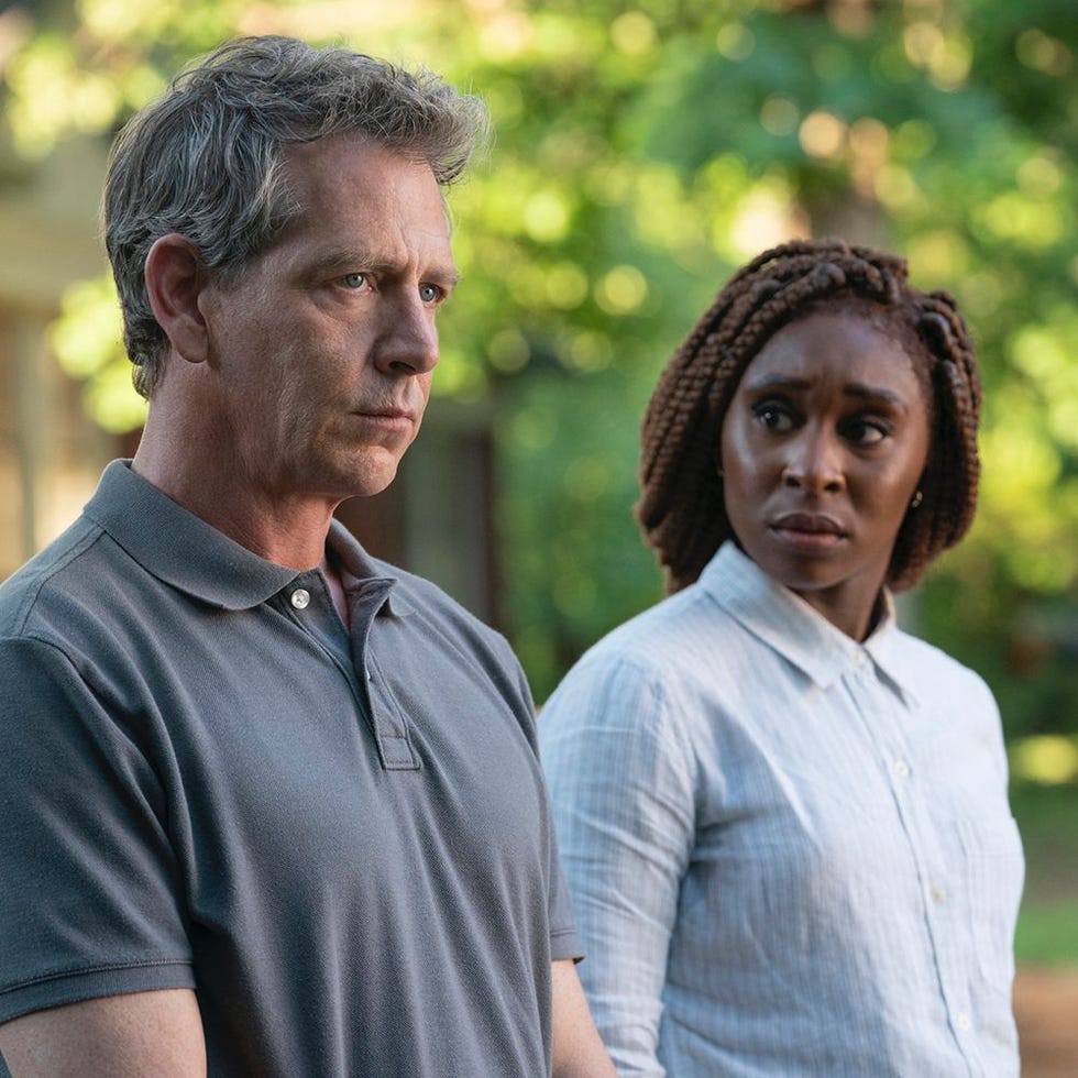 two people standing outdoors in a natural setting