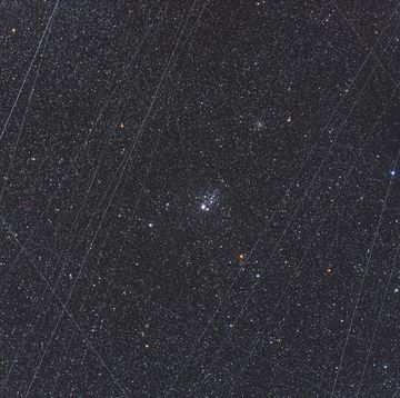 ngc 457, the owl cluster in cassiopeia, with accumulated satellite trails