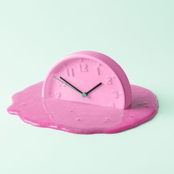 the pink clock melts against the birch background creative concept of time