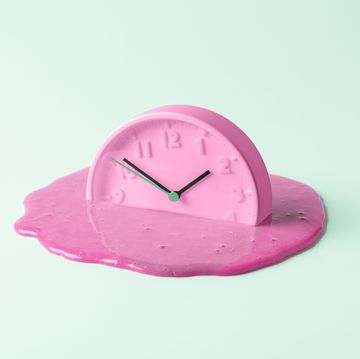 the pink clock melts against the birch background creative concept of time