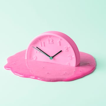 the pink clock melts against the birch background creative concept of time