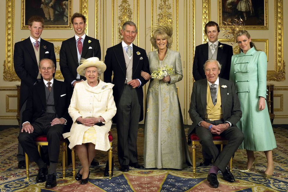 prince philip, queen elizabeth ii and bruce shand sit in the front row, prince harry, prince william, prince charles, camilla parker bowles, tom parker bowles and laura parker bowles stand in the back row inside an ornate room