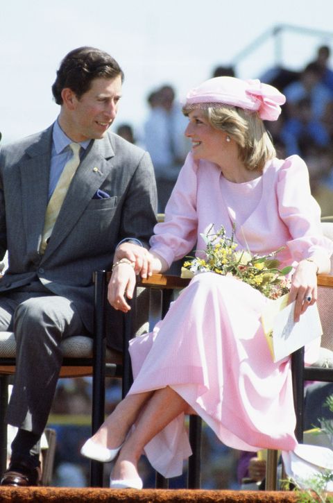 the prince of wales holds diana, princess of wales' hand dur