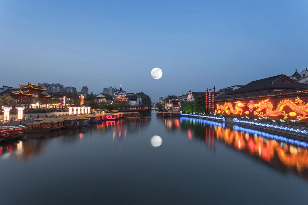 the qinhuai river in nanjing, jiangsu province of china a full moon in the night