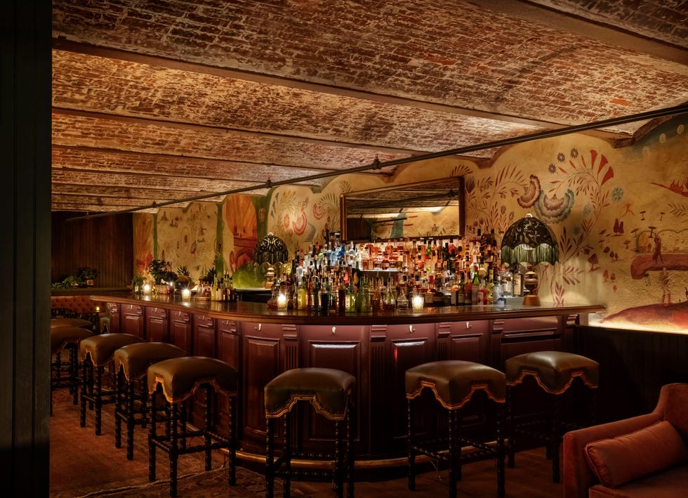 a bar with chairs and tables