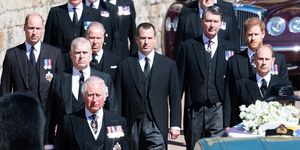 the men of the royal family walking behind queen elizabeth's coffin