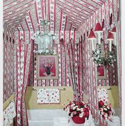 bathroom with wallpaper stripes and floral