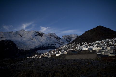 the sleeping beauty glacier lays above the peruvian gold rush town of la rinconada which stands at a