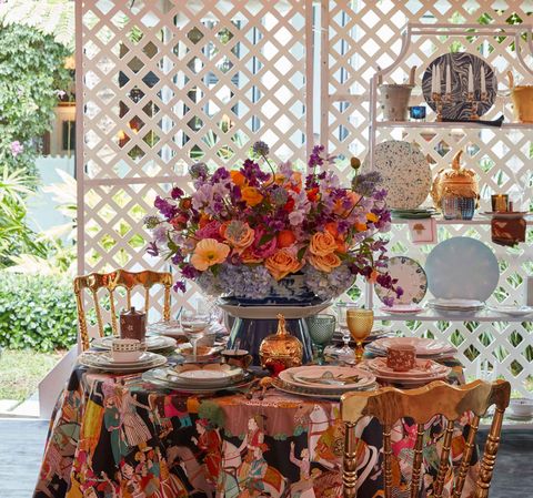 Table, Room, Orange, Tablecloth, Floral design, Dining room, Flower, Interior design, Textile, Flower Arranging, 