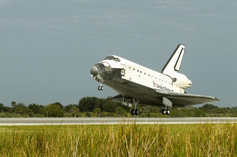 The space shuttle Atlantis touches down