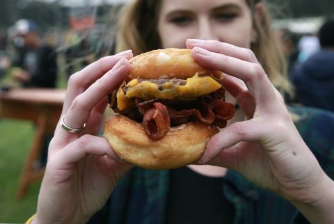 the straw carnival fare in hayes valley in san francisco, is serving up the ringmaster a glazed donut bun cheeseburger during day two of the outside lands music festival in golden gate park in san francisco, california, on sat aug 6, 2016