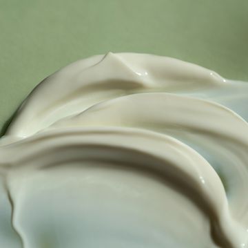 the texture of the cream on a green natural background