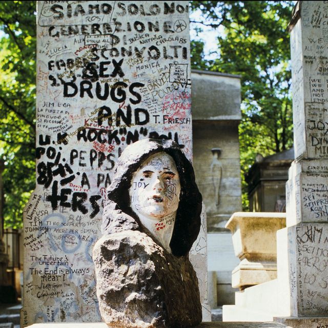 the tomb of jim morrison in paris, france in june, 1985.