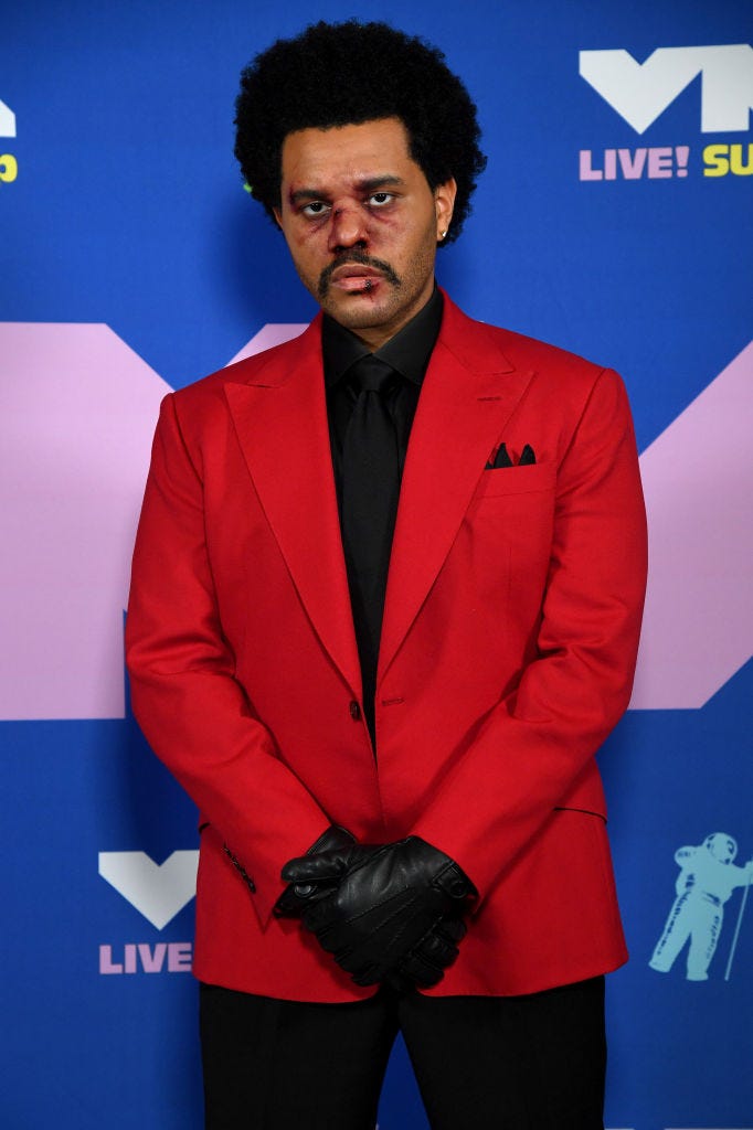 The Weeknd sports bloody makeup and bandaged nose on his way to