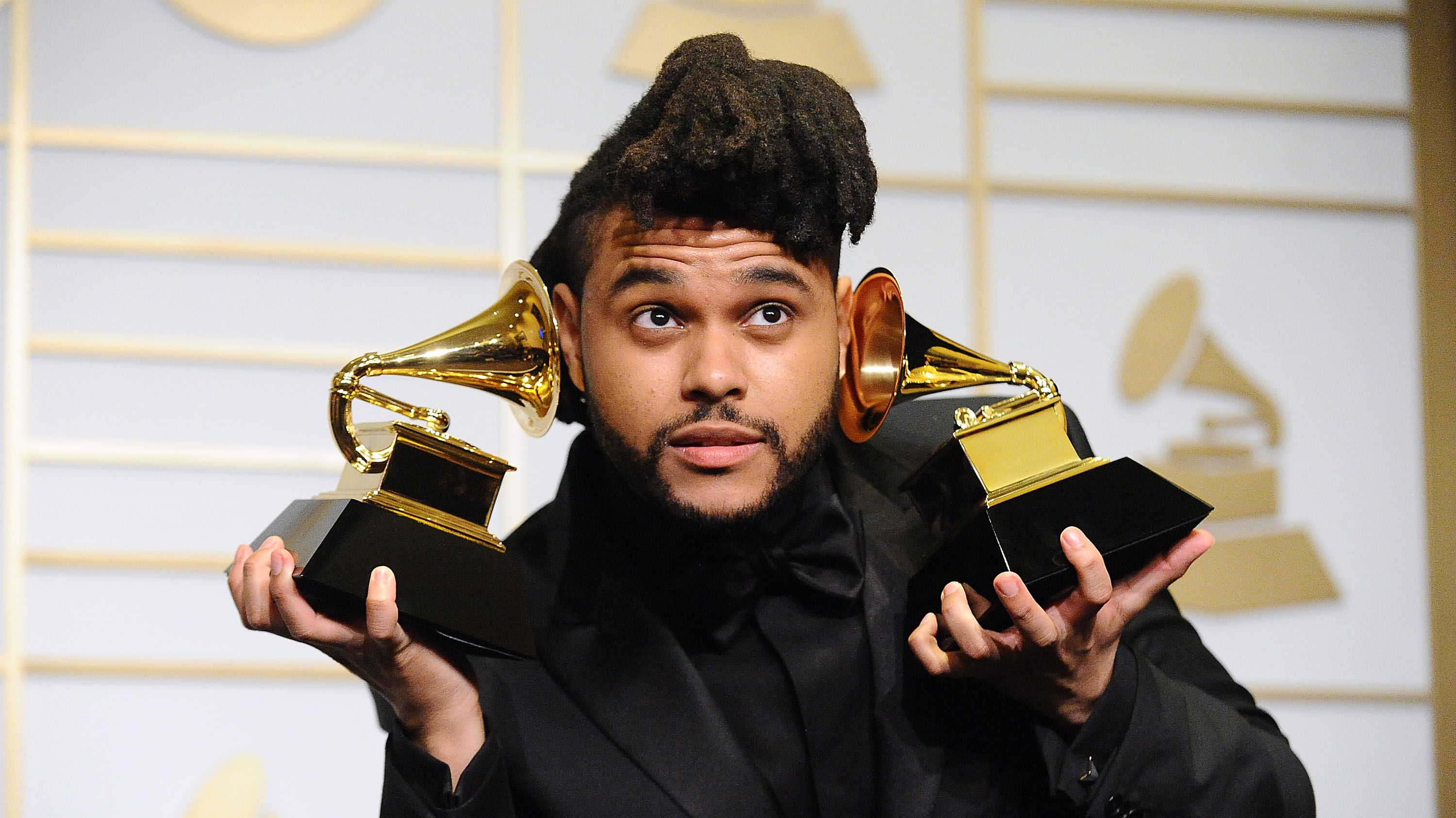 https://hips.hearstapps.com/hmg-prod/images/the-weeknd-poses-in-the-press-room-at-the-the-58th-grammy-news-photo-1615501280.?crop=1xw:0.8268xh;center,top