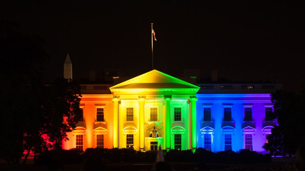the white house lit in rainbow colors