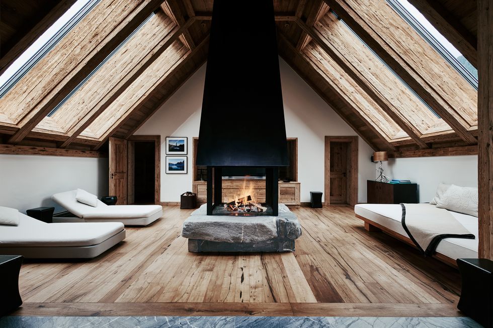 a room with a bed and a fireplace