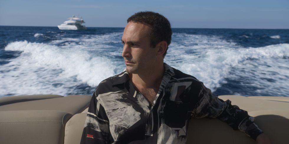 a man sitting on a boat