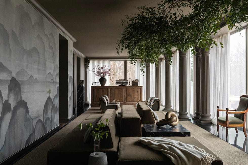 monochromatic gallery with mural wallpaper and tree