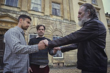 theo james, daniel ings, pearce quigley, holding hands in a still from the gentlemen