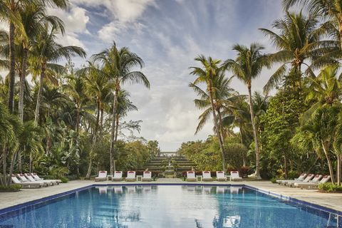 Swimming pool, Resort, Property, Palm tree, Tree, Sky, Vacation, Real estate, Arecales, Water, 