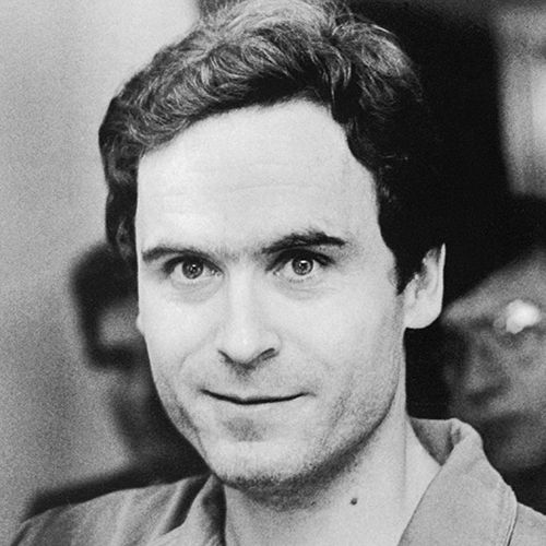 ted bundy looks at the camera with a slight smile