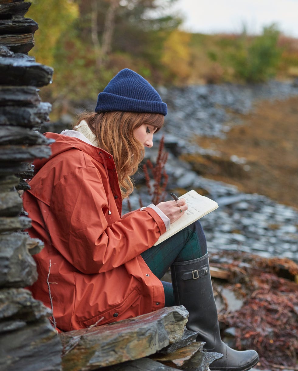 woman writing in a journal