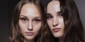 a couple of women posing for the camera