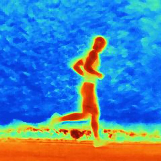 thermal photograph of young male athlete running. the image shows the heat of the muscles
