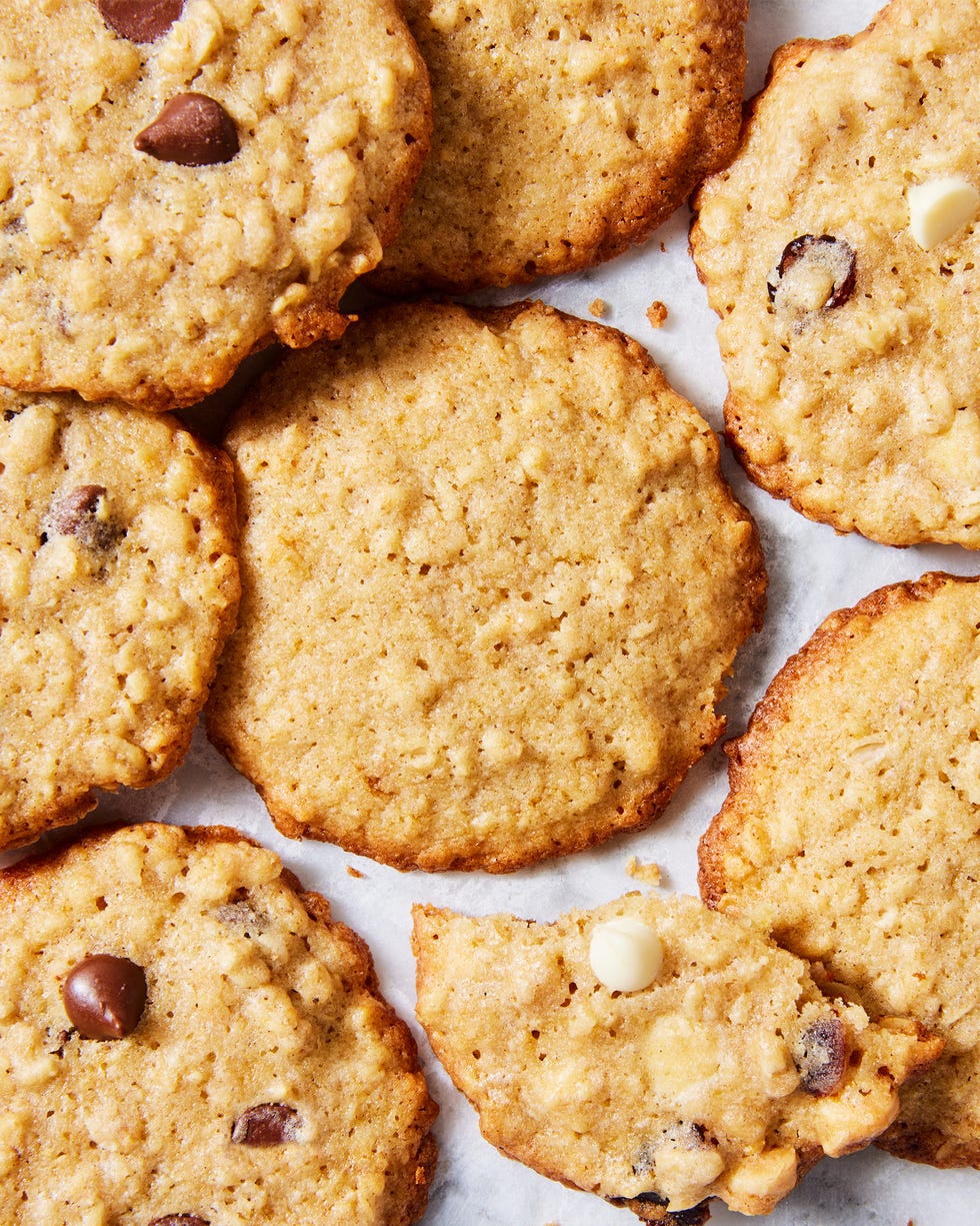 thin and crispy oatmeal cookies with chocolate chips, raisins, and white chocolate chips