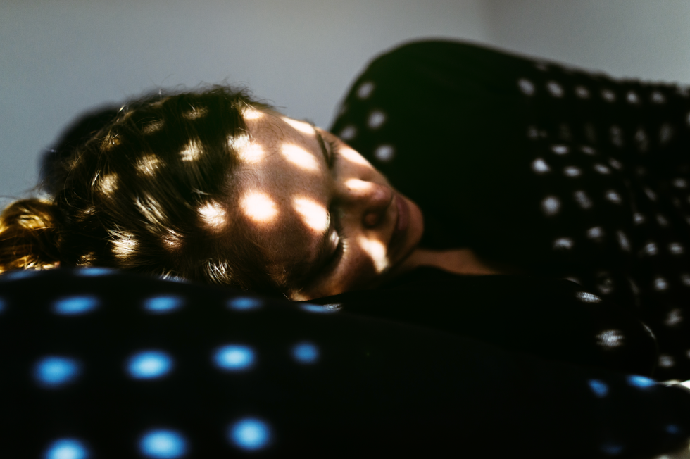 woman lying in the dark depressed