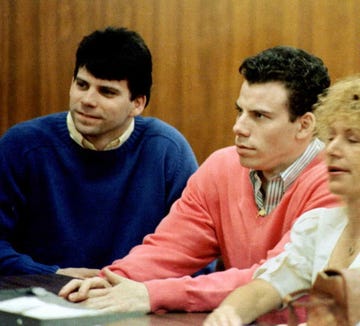lyle and erik menendez looking toward the judge while sitting at a table