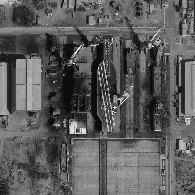This is a close-up DigitalGlobe Satellite Imagery showing the construction of what appears to be a fake mock-up of a U.S. aircraft carrier near Bostanu, Iran.