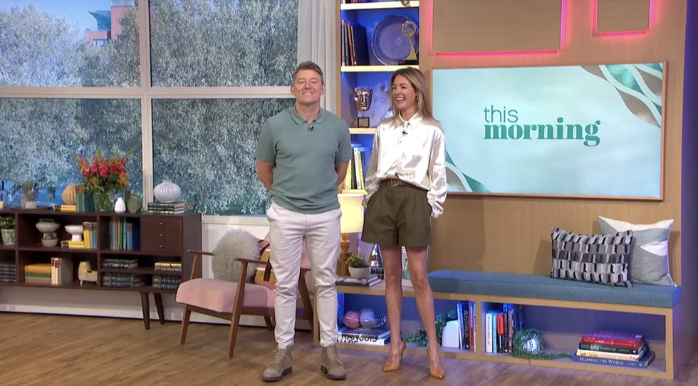 cat deeley presenting this morning in khaki shorts and a white top
