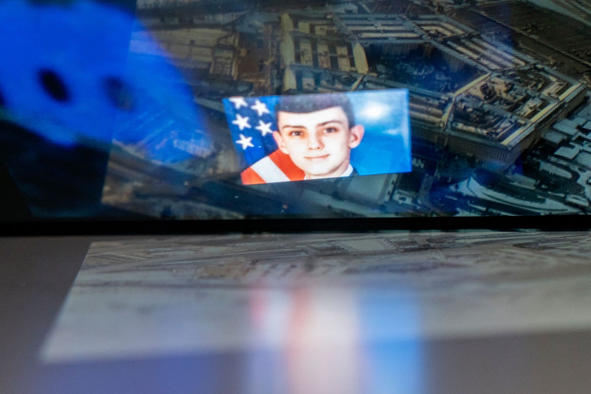 an illustration with a photo jack teixeira imposed over the pentagon